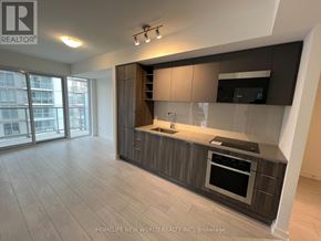 Toronto (Agincourt South-Malvern West) condo for rent - A modern kitchen with dark brown cabinets and a black oven.