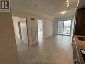 Toronto (Agincourt South-Malvern West) condo for rent - A spacious room with wooden flooring and a large window.