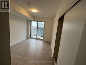 Toronto (Agincourt South-Malvern West) condo for rent - A room with a sliding glass door leading to a balcony.