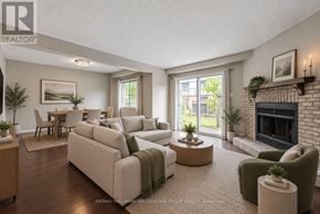 Mississauga (Erin Mills) townhouse for rent - A living room with a fireplace and a couch.