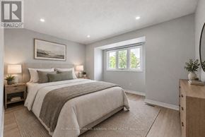 Mississauga (Erin Mills) townhouse for rent - A bedroom with a large bed and a window.
