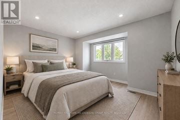 Mississauga (Erin Mills) townhouse for rent - A bedroom with a large bed and a window.
