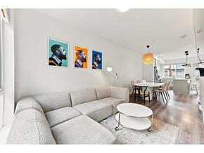 Surrey apartment for rent - A living room with a grey sofa and a white coffee table.