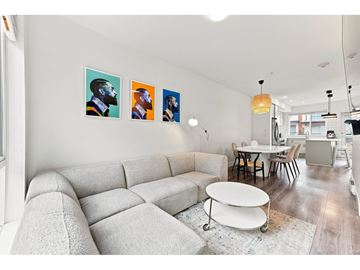 Surrey apartment for rent - A living room with a grey sofa and a white coffee table.