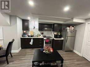 Mississauga (Lisgar) apartment for rent - A black table with a vase of flowers on it sits in the middle of a kitchen.