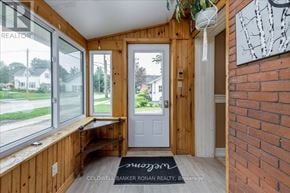 Grey Highlands apartment for rent - A room with a white door and a window with a view of a street.