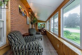 Grey Highlands apartment for rent - A room with a brick wall and a row of chairs.