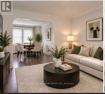St. Catharines (Downtown) duplex for rent - A living room with a white couch and a coffee table.