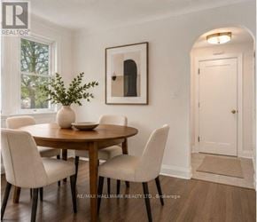 St. Catharines (Downtown) duplex for rent - A dining room with a round table and chairs.