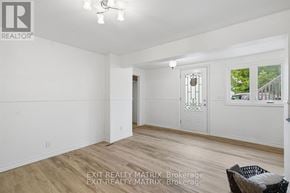 Alfred And Plantagenet multi-family for rent - A room with a window and a door in it.