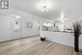 Alfred And Plantagenet multi-family for rent - A room with a white door and a window with a stained glass design.