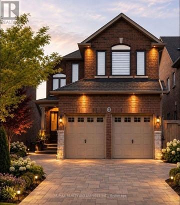Caledon (Bolton West) apartment for rent - A house with a brick facade and two garages is shown.