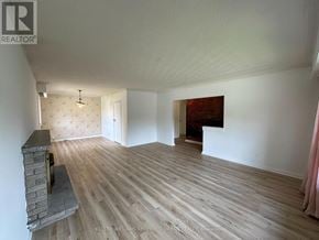 Toronto (Newtonbrook East) apartment for rent - A room with a fireplace and wood flooring.
