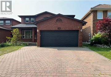 Richmond Hill (Harding) apartment for rent - A brick house with a black garage door is for sale.
