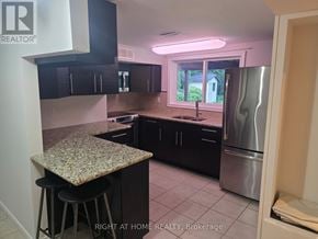 Richmond Hill (North Richvale) apartment for rent - A kitchen with granite countertops and stainless steel appliances.