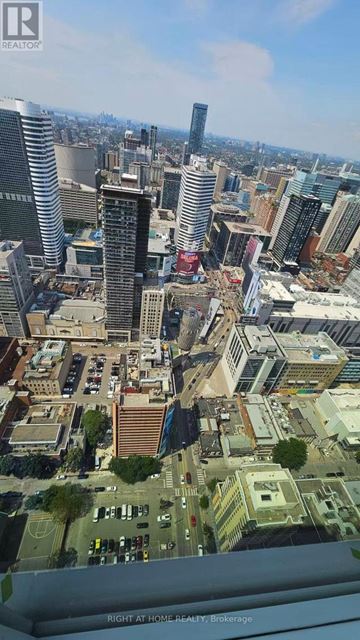Toronto (Church-Yonge Corridor) condo for rent - A cityscape with a mix of residential and commercial buildings.