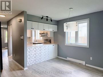Ottawa condo for rent - A kitchen with a white counter and cabinets.