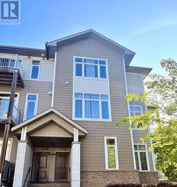 Ottawa townhouse for rent - A two-story residential building with a balcony on the second floor.