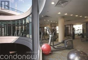 Toronto (Waterfront Communities) condo for rent - A gym with a variety of equipment including a red ball.