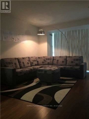 Toronto (Waterfront Communities) condo for rent - A living room with a couch and a rug.