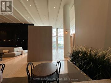 Vaughan (Vaughan Corporate Centre) condo for rent - A modern living room with a dining table and chairs.