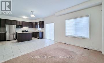 Brant (Paris) apartment for rent - A kitchen with white cabinets and a stainless steel refrigerator.