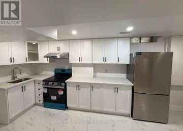 Mississauga (Central Erin Mills) apartment for rent - A kitchen with white cabinets and a stove top oven.