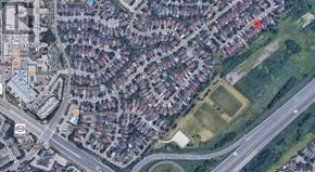 Mississauga (Central Erin Mills) apartment for rent - A satellite image of a residential area with houses, roads, and a few marked locations.