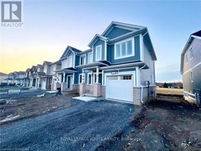 Loyalist (Bath) apartment for rent - A row of houses with the first one being a two story house with a garage.