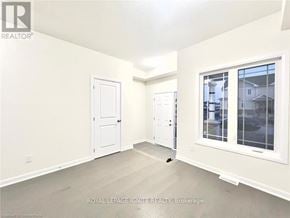 Loyalist (Bath) apartment for rent - A white room with a door and a window.