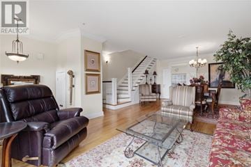 St. John's apartment for rent - A living room with a brown leather couch and a glass coffee table.