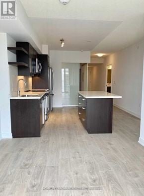 Toronto (Church-Yonge Corridor) condo for rent - A spacious kitchen with a refrigerator, oven, and sink.