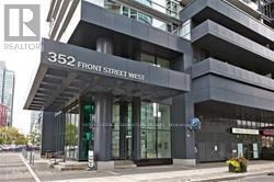 Toronto (Waterfront Communities) condo for rent - A modern building with the number 352 on it.