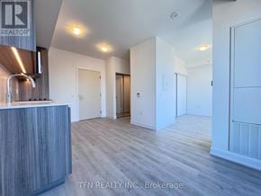Toronto (Waterfront Communities) condo for rent - A realtor's office with a reception desk and a sign that says "TEN REALTY INC., Brokerage".