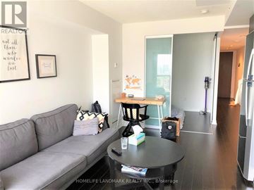 Toronto (Bay Street Corridor) condo for rent - A living room with a grey couch and a coffee table.