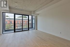 Toronto (South Riverdale) condo for rent - A room with a sliding glass door leading to a balcony.
