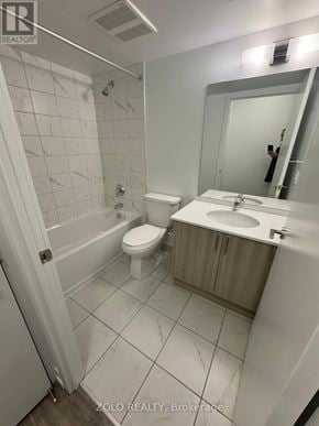 Pickering (Bay Ridges) house for rent - A white bathroom with a toilet, sink and mirror.