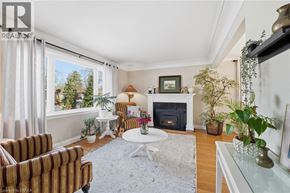 Brantford apartment for rent - A living room with a fireplace and a couch.
