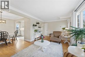 Brantford apartment for rent - A living room with a white table and striped chairs.