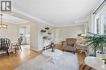Brantford apartment for rent - A living room with a white table and striped chairs.