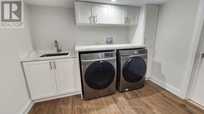 Mississauga (Lakeview) apartment for rent - A laundry room with a washer and dryer.