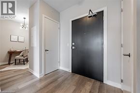 Burlington condo for rent - A black door is in the middle of a white wall.