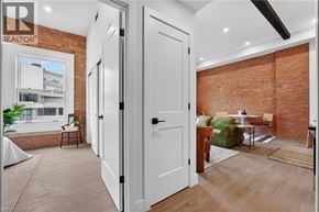 Hamilton apartment for rent - A room with a white door and a brick wall.