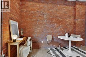 Hamilton apartment for rent - A room with a white table and a brown chair.