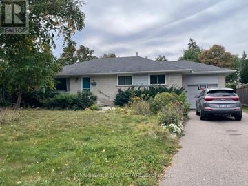 Mississauga (Streetsville) apartment for rent - A house with a car parked in front of it.