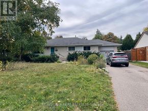 Mississauga (Streetsville) apartment for rent - A house with a car parked in front of it.