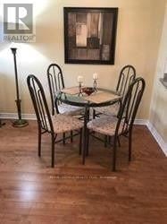 Mississauga (Hurontario) condo for rent - A dining table with four chairs around it.