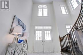 Brampton (Northwest Brampton) apartment for rent - A white interior of a house with a staircase on the right.