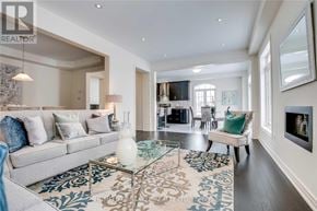 Brampton (Northwest Brampton) apartment for rent - A living room with a grey sofa and a glass coffee table.