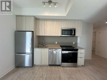Milton (Cb Cobban) condo for rent - A kitchen with a refrigerator, microwave, and stove.